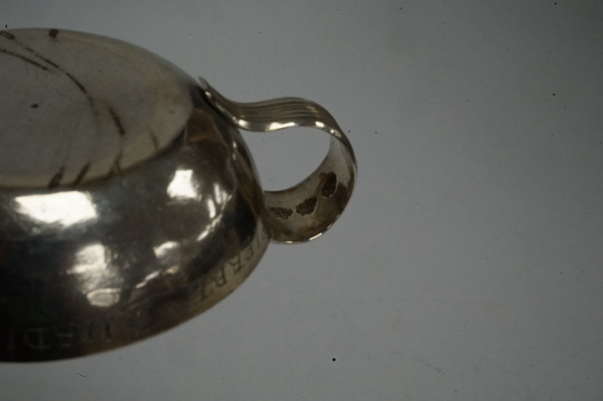 A late 18th/early 19th century French white metal taste vin, makers mark GI below a crown stamped three times, diameter 85mm, 125 grams. Condition - fair